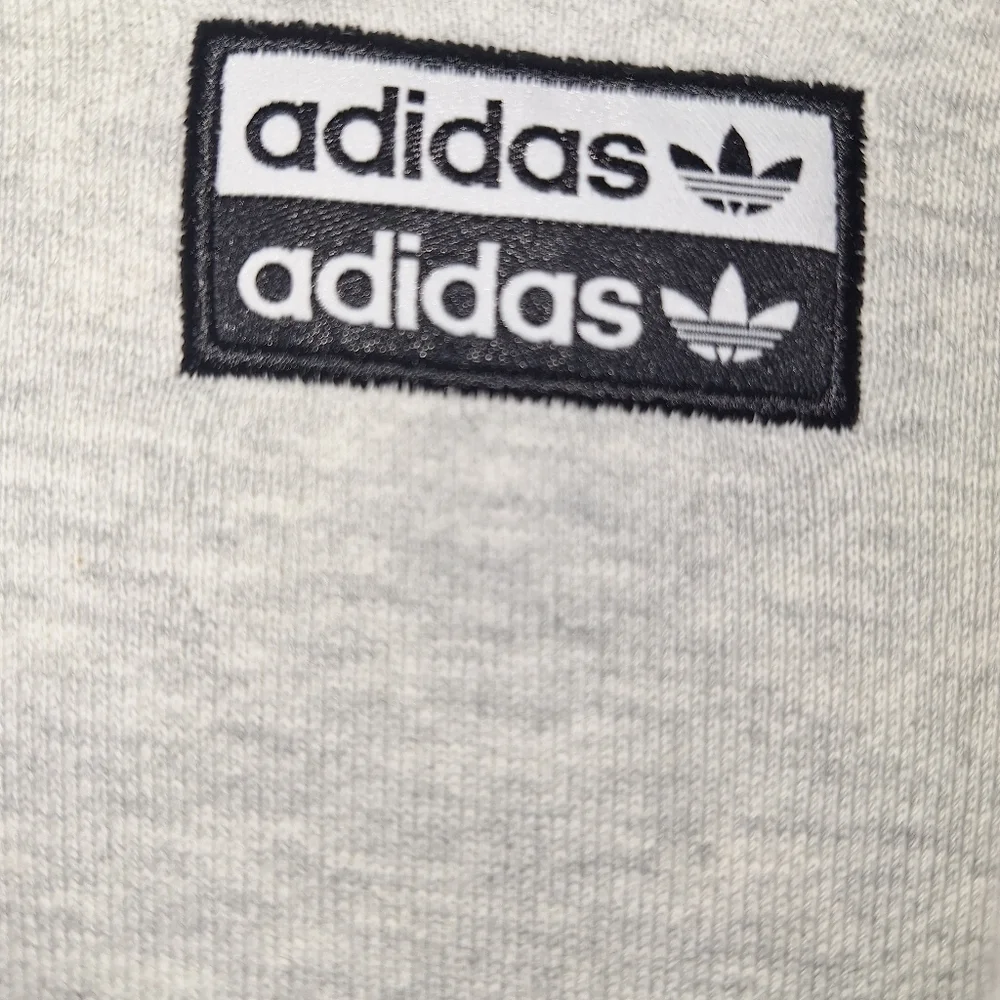 An Adidas hoodie in a mens size small. It's pre-loved and in great condition.